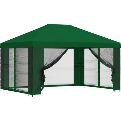 Le chalet de jardin a des murs de 4 x 3 mètres et est fabriqué en fibre de polyester verte et en acier. (1/5)