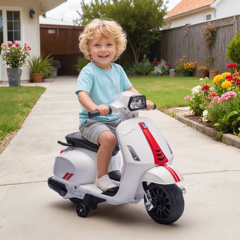 Moto elettrica per bambini dai 2 ai 6 anni con batteria da 6V, faro, clacson e rotelle stabilizzatrici - Bianca