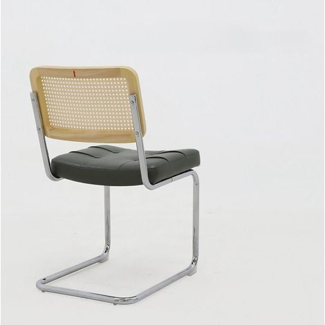 Set de 2 sillas de comedor de polipiel verde con patas cromadas y respaldo de ratán (1/5)