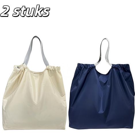 Lot de 2 sacs de courses pliables et réutilisables en nylon imperméable. Fermeture à cordon et poignées renforcées. Idéaux pour ranger vos courses. Disponibles en blanc et bleu marine. (1/5)