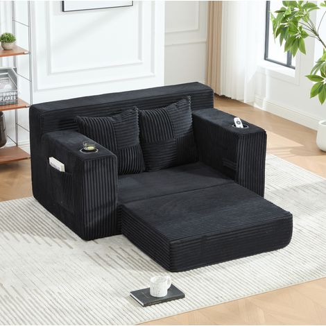 Divano pouf 151/133/64 cm in velluto a coste nero con tasche laterali e 2 cuscini (1/5)