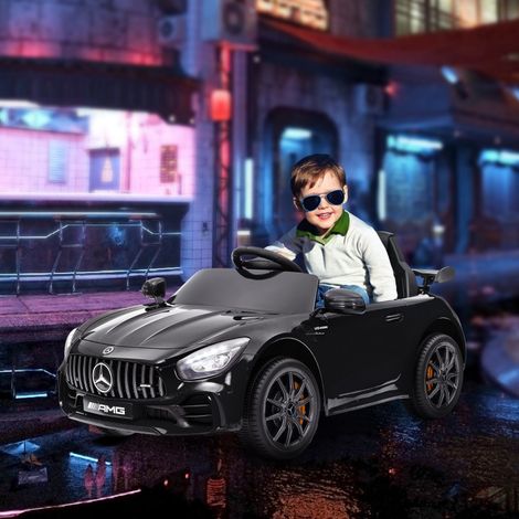 Coche eléctrico infantil (108x67x46 cm), con mando a distancia, luces y música, plástico negro (1/5)
