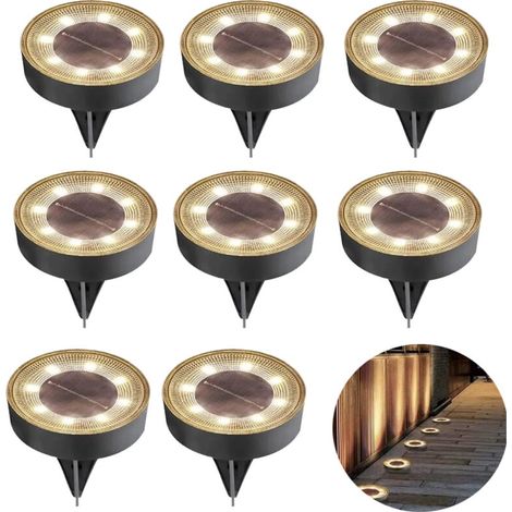 Lot de 8 lampes solaires de jardin LED étanches IP68, blanc chaud, pour une utilisation extérieure.