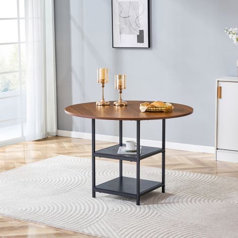 Table à manger ronde — Présente une finition couleur noyer ainsi qu'une étagère de rangement à deux niveaux le plateau est fabriqué en panneau de fibres à densité moyenne (MDF) et repose sur une stru