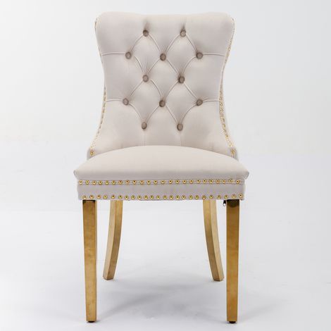 Lot de 2 chaises design beige et or, piètement acier inoxydable doré, assise en velours capitonné avec clous décoratifs, bois massif haut de gamme, modèle DE1601BG.