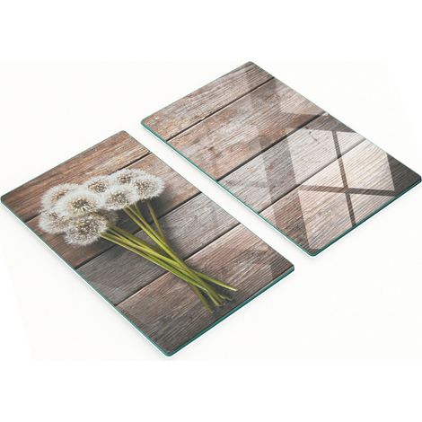 Tableros de vidrio templado con un estampado decorativo de dientes de le贸n sobre tableros de 2x30x52 cm.