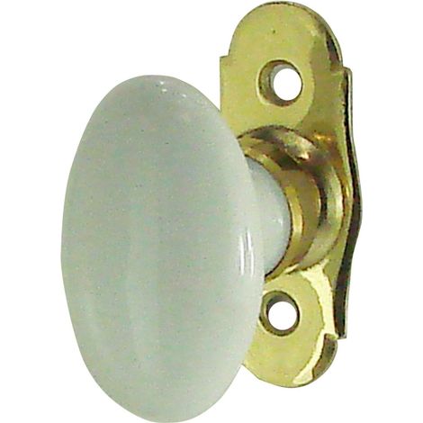 Pomello ovale per finestra in porcellana bianca e ottone lucido.