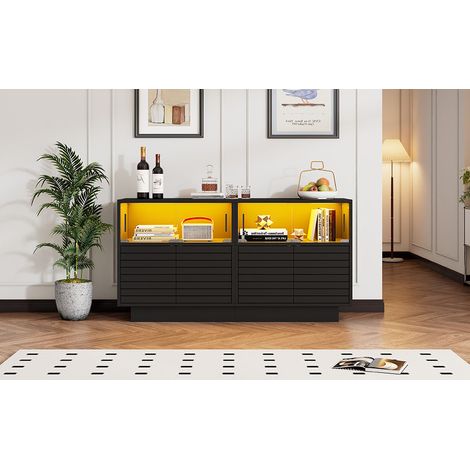 Armoire de 130×35×68 cm. Elle comprend 2 compartiments, 4 tiroirs, et des portes en verre. La largeur est de 130 cm. L’armoire dispose également d’un éclairage LED. (1/5)