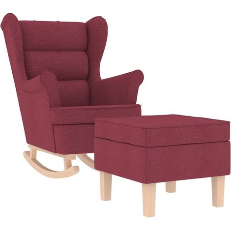 Un fauteuil à bascule avec repose-pieds, en tissu bordeaux. (1/5)