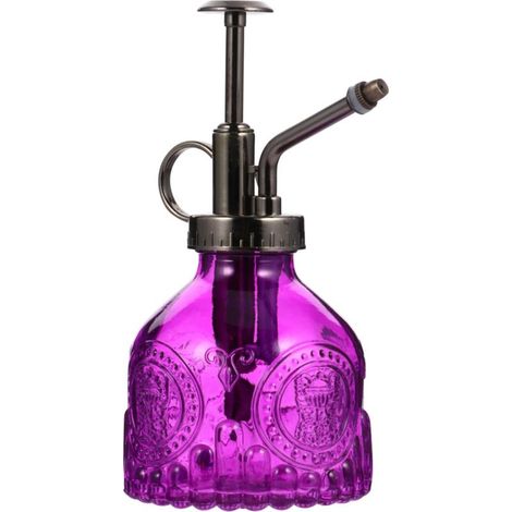 Petit flacon pulvérisateur en verre transparent, de taille compacte, corps violet avec embout en bronze. (1/5)