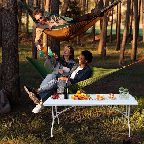 Table pliante 180 cm ultra résistante, usage intérieurextérieur, supporte 135 kg, avec poignée de transport (1/5)