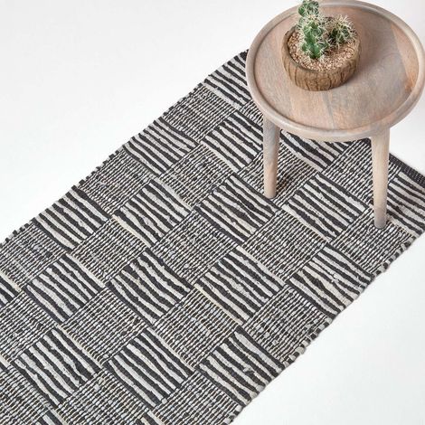 HOMESCAPES Black & White Real Leather Handwoven Striped Block Check Rug, 66 x 200 cm