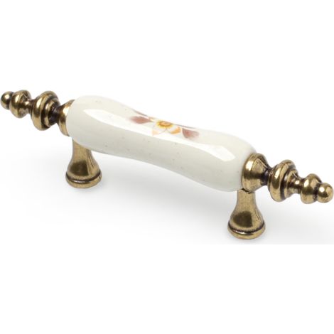 Tirador de Asa para Mueble  Estilo Clásico  Fabricado en Porcelana  Acabado en Blanco  Distancia Entrepuntos: 64 mm  Medidas 1241831 mm  Sistema de Fijación  Incluye Tornillos M4  2 Unidades -