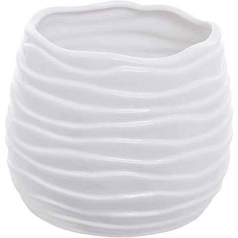 Modern ceramic flower pot in red, has a drainage hole and a wavy design. (1/5)