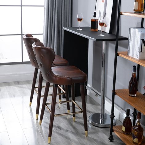 Lot de 2 tabourets de bar hauts de style industriel avec dossier et repose-pieds. Assise en similicuir et pieds en bois. Tabourets vintage pour cuisines et restaurants. 52 x 53 x 101 cm