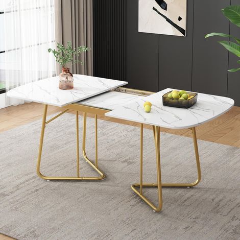 Table de salle à manger extensible blanche avec piètement en marbre et pieds en métal doré. Elle s'étend jusqu'à 140 x 80 cm et convient pour 4 à 6 personnes. (1/5)