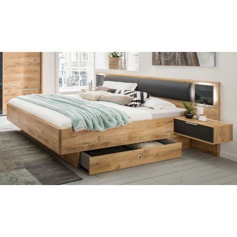 Pegane – Lit futon adulte avec 2 chevets – Imitation chêne poutre – Dimensions 180 x 200 cm – Tiroirs avec glissières métal – Tête de lit rembourrée (1/2)