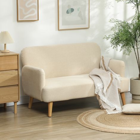 Divano a due posti, compatto, rivestimento anallergico, portata massima 240 kg, dimensioni 130x74x79 cm, colore bianco crema.