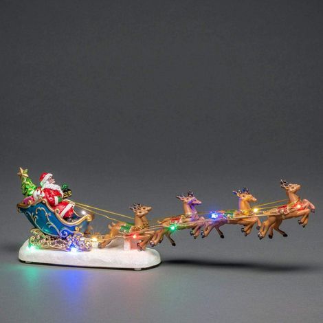 Leuchtende Weihnachtsdekoration, die einen Weihnachtsmann in seinem... (1/5)