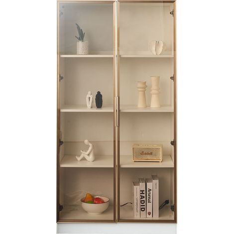 Set de salon moderne : deux vitrines en verre blancs, équipées d’éclairage LED. Les étagères peuvent être ajustées à la volonté du client. La couleur des éléments est platine.