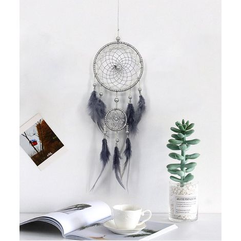 Un acchiappasogni grigio con due anelli, ideale come decorazione da parete per la casa. (1/4)