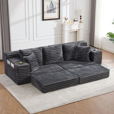 Canapé convertible de pana gris oscuro 273x98x87 cm con respaldo alto, bolsillos laterales y portavasos