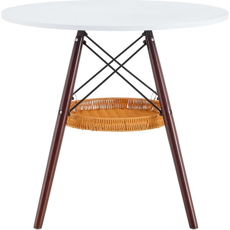 CAIziTable à manger ronde Ø 80 cm, plateau en MDF blanc, pieds en bois massif couleur noyer, associée à une structure de panier de rangement tressé suspendu, adaptée pour 2 à 4 personnes.