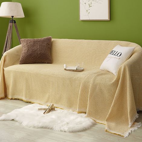 Tapis gaufré pour canapé 180x300cm. Grand tapis pour canapé 3 places. Tapis polyvalent pouvant servir de tapis de canapé, de couvre-canapé ou de jeté de lit. Orné de pompons décoratifs. Gris clair. (1/5)