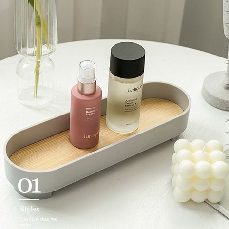 Plateau ovale design étroit, polyvalent et élégant, gris, pour rangement maquillage et parfum, déco maison.