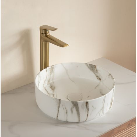Lavabo sobre encimera redondo moderno de cerámica blanca efecto piedra (1/5)