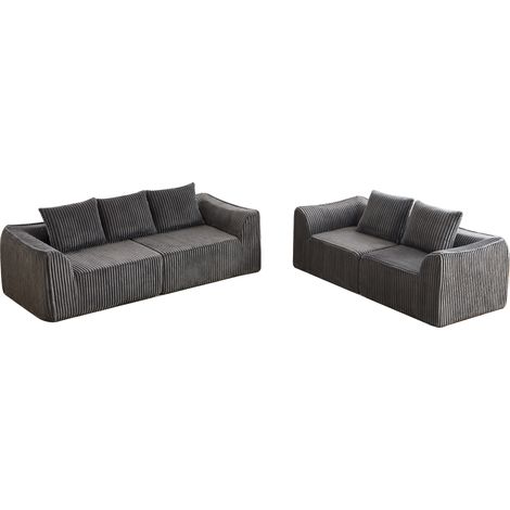 Sofá modular gris de cordón con líneas minimalistas y respaldo curvado (1/5)