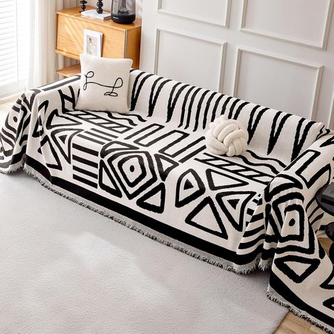 Housse de canapé d'angle 3 places en chenille, anti-rides, avec glands décoratifs, style boho noir et blanc, 180x340 cm. (1/5)