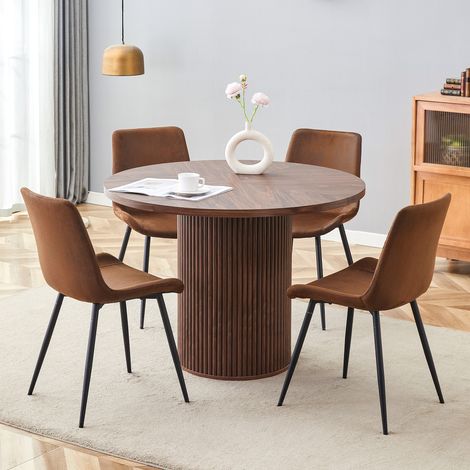 Ensemble table ronde minimaliste avec 1 table et 4 chaises. Table à manger ronde en MDF de 100 cm de diamètre en finition noyer. Associée à 4 chaises en tissu high-tech avec assise élargie.