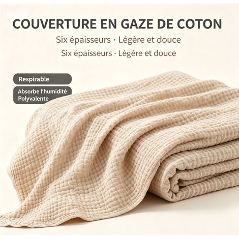 Cette couverture blanche en pur coton, lavable et respirante, convient parfaitement aux canapés, aux lits, aux fauteuils inclinables ou pour se détendre à la maison. (1/5)