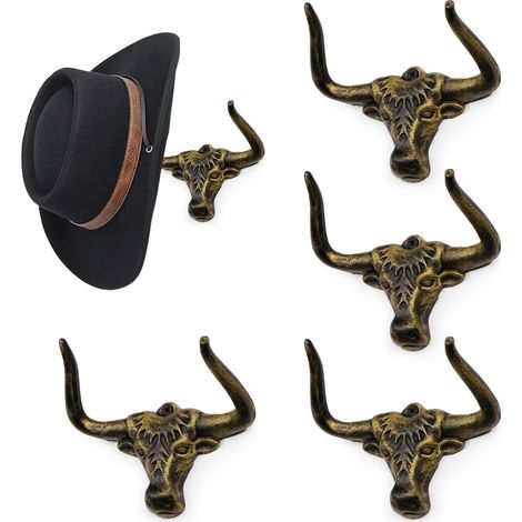 Conjunto moderno de 4 puertas-chapeaux de cowboy en metal, con crochets largos en forma de cornes, para disposición y presentación en un cartel. (1/5)