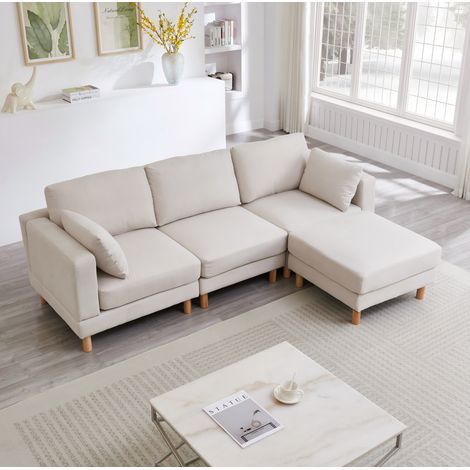 Divano angolare 235x152x78 cm beige in poliestere con pouf modulare e chaise longue reversibile (1/5)