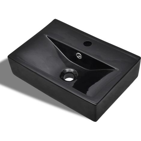 Lavabo en céramique noire rectangulaire avec robinetterie et trop-plein.