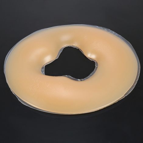 Coussin de spa en silicone beige pour soins de beauté, repose-visage et massage corporel relaxant. (1/5)