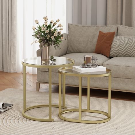 Set di 2 tavolini da salotto rotondi e ovali in acciaio e vetro temperato color oro (1/5)