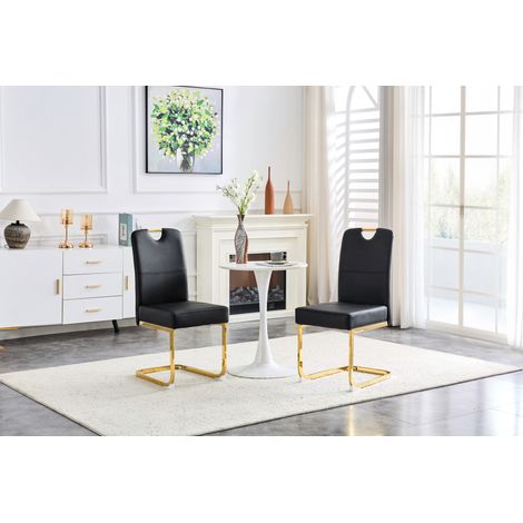 Juego de 2 sillas de comedor de PU negro, respaldo ergonómico y patas doradas OKMYHOME (1/5)