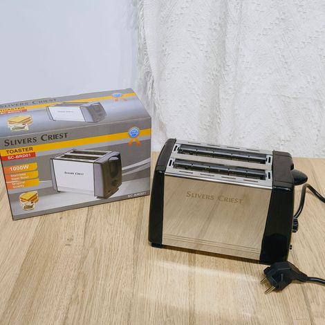 Ce grille-pain à double fente extra large est fabriqué en acier inoxydable et est parfait pour cuire du pain,des bagels,des gaufres et des pâtisseries (1/4)