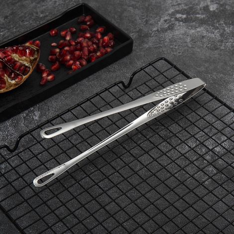 Pince alimentaire en acier inoxydable pour la cuisson du pain, du barbecue et des steaks. (1/4)