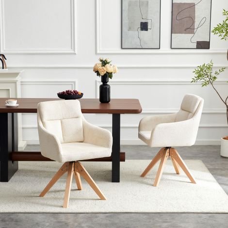 Ensemble de deux chaises de salle à manger pivotantes à haut dossier. Revêtement en velours texturé beige clair et pieds en bois massif. Pivotantes à 360°, elles s'accordent avec différents styles de (1/5)