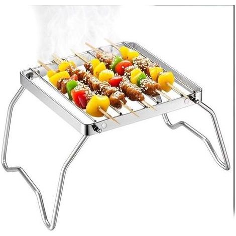 Gril de cuisson pliable : accessoire portable en acier inoxydable pour le camping, la randonnée, les pique-niques et les barbecues en plein air. (1/4)