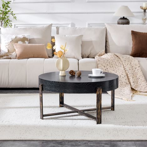 Table basse ronde 68 cm, style industriel vintage. Plateau MDF noir effet bois, pieds croisés métal bronze patiné, parfaite pour déco Wabi-Sabi ou loft. Table d'appoint élégante. (1/5)