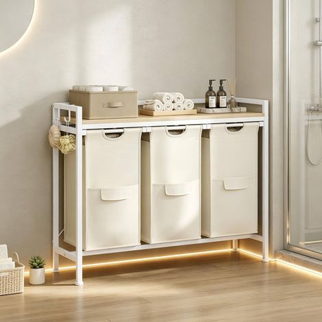 Mueble de almacenaje con 3 cestos de ropa extraíbles, 96 x 30 x 71 cm, blanco y roble claro HAVRYA (1/5)