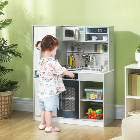 Cuisine pour enfants avec vaisselle en inox, plaque de cuisson, évier avec jet d'eau, effets lumineux et sonores, blanche