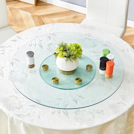 Plateau de table. Plateau rond en verre à deux niveaux, pivotant. Le diamètre du plateau supérieur est de 77 cm, celui du plateau inférieur de 38 cm. Son système pivotant facilite la prise en main et 