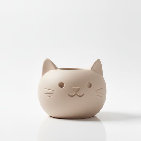 Vaso decorativo beige a forma di gatto, perfetto per piante grasse.