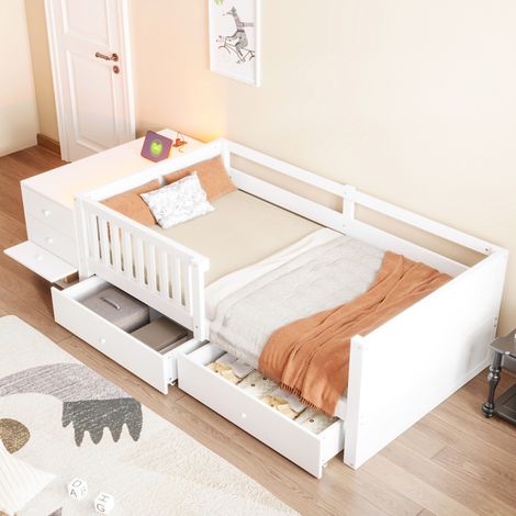 Cama infantil 90x200 cm en madera blanca con almacenaje modular, LED, enchufe integrado y barandillas de seguridad (1/5)
